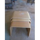 A nest of three Art Deco style tables
