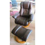 A leather reclining chair and stool