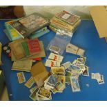 An Austin A40 service manual, other car manuals, cigarette cards, Scout books and an 1816 family