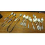 Twelve teaspoons stamped 800, two pairs of silver sugar tongs and three silver spoons