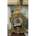 A green lacquered ornate clock with floral design and gilt mounts with matching wall bracket