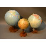 A Colombus World Globe On Stand together with another similar and a small globe by Universal