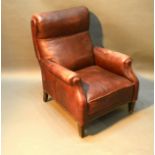 A Beige Leather Upholstered Armchair with square tapering legs