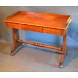 A William IV Mahogany Side Table, the moulded gallery top above a frieze draw raised upon end