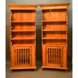 A Pair of Pine Narrow Bookcases, each with a moulded cornice above a boarded shelf back, the lower