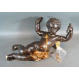 A Patinated Model Of Putti 43 cms long