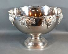 A Silver Plated Punch Bowl with grapevine decoration upon a pedestal base 40 cms diameter
