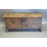 An 18th Century Oak Chip Carved Coffer, the hinged top above an Arcadian front, 115 cms wide x 36