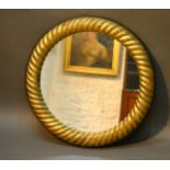 A Circular Gilded Wall Mirror of spiral form, 77 cms diameter