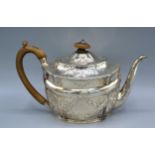 A George III Silver Teapot of foliate and scroll embossed form, London 1801, maker Daniel