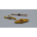 A 9ct Gold Amethyst Set Bar Brooch together with another similar 9ct gold bar brooch and a yellow