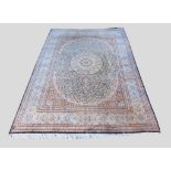 A North West Persian Silk Large Carpet with a central medallion within an all over design upon a