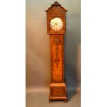An Early 20th Century Walnut Long Case Clock by Maple of London, the square hood above a carved