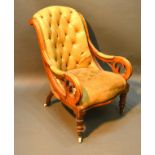 A Victorian Mahogany Button Leather Upholstered Library Armchair with turned tapering legs, brass