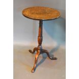 A 19th Century Oak Pedestal Table, the circular top above a turned centre column raised upon