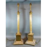 A Pair Of Brass Table Lamps of Corinthian form, 70 cms tall