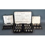 A Set of Twelve Sheffield Silver Teaspoons with Tongs in fitted case together with two cased sets of