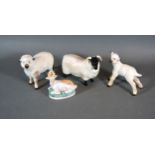 A Beswick Model Of A Ram together with two Beswick sheep and a small model of a deer