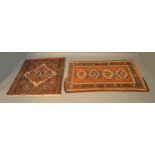 A North West Persian Woollen Small Rug with four central guls within multiple borders, 121 x 79