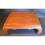 A Large Hardwood Coffee Table of square form with shaped frieze and similar legs 130 cms square,