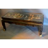 A Japanese Lacquered Low Table of rectangular form, the top inset various hard stone depicting