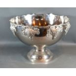 A Silver Plated Punch Bowl with grapevine decoration upon a pedestal base 40 cms diameter