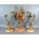 A French Three Piece Clock Garniture, the clock of grape vine form flanked by two branch