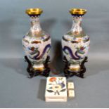A Pair of Cloisonne Oviform Vases with hardwood stands 28 cms tall together with a Pietra-Dura