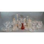 A 19th Century Glass Decanter with stopper together with a collection of other decanters and other