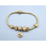 A 14ct Gold Pandora Charm Bracelet with five charms 34.4 gms