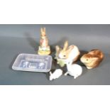 A Beswick Beatrix Potter Figure 'Fierce Bad Rabbit' together with a Lladro model of a rabbit,