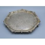 A Victorian Silver Salver of shaped outline with ball and claw feet London 1899 by The