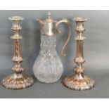 A Pair Of Silver Plated Candlesticks together with a silver plated and glass claret jug