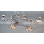 A Pair Of Silver Plated Two Branch Candelabrum with shaped knopped stems upon square bases 19 cms
