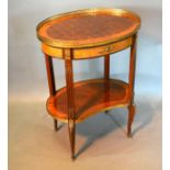 A French Oval Side Table the pierced brass galleried top above a frieze drawer raised upon