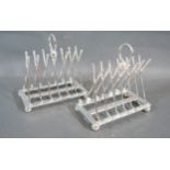 A Pair Of Silver Plated Six Division Toast Racks in the form of golf clubs, the feet in the form