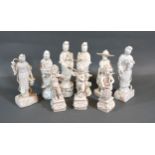 A Pair of Blanc de Chine Figures together with four similar and three Dresden porcelain figures
