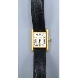 A Cartier 18ct. Gold Tank 1150 Wrist Watch with leather strap and original buckle marked 750 and