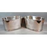 A Pair Of Champagne Wine Coolers inscribed Bollinger 34 cms long