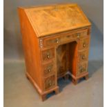 A Circa 1920's Queen Anne Style Walnut Bureau, the fall front enclosing a fitted interior above