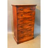 A 19th Century Mahogany Narrow Chest of Five drawers with knob handles raised upon a plinth base,