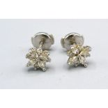 A Pair Of Platinum Diamond Cluster Ear Studs by Tiffany & Co. of cluster form