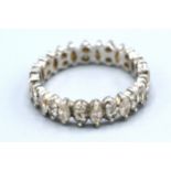 A White Metal Full Eternity Ring set with marquise cut diamonds interspaced with double diamonds,
