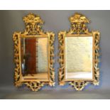 A Pair Of 19th Century Gilt Wood Wall Mirrors each with a pierced cresting and within foliate scroll