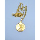 An 18ct Gold Pendant with 18ct gold fine link chain 5.2 gms