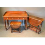 A Victorian Mahogany Side Table, the moulded galleried top above two drawers raised upon turned