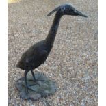 A Composition Garden Statue in the form of a Heron with naturalistic base, 98 cms tall