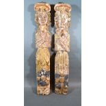 A Pair Of Early Carved And Polychrome Decorated Wooden Columns 56 cms tall