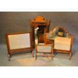 A Walnut Chippendale Style Wall Mirror together with three swing frame toilet mirrors