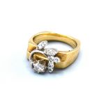 A 14ct Gold Double Diamond Ring to include a solitaire, claw set and another set smaller diamonds
